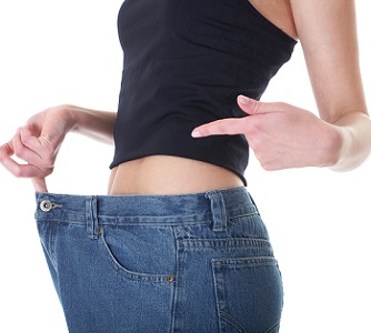 Woman Taking Garcinia With Big Size Jeans