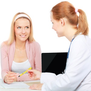 Woman Consulting Doctor