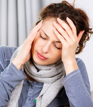 Woman Experiencing Migraine