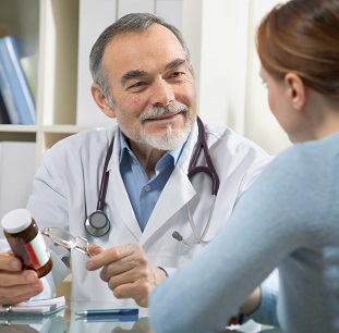 Woman Consulting Doctor