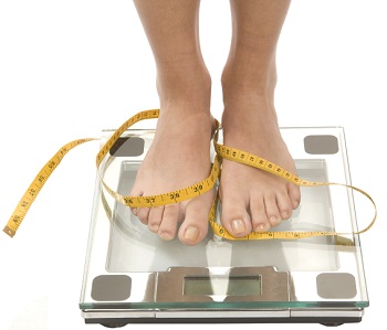 Woman on Weighing Scale