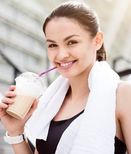 Woman Drinking Coffee After Workout