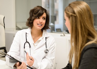 Doctor explaining diagnosis to her female patient