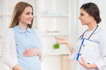 Pregnant Woman Consulting Doctor