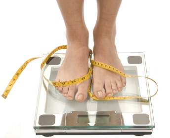 Woman Feet on Weighing Scale