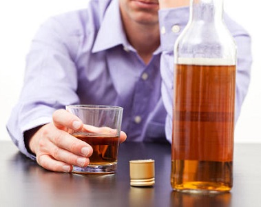 Man with Glass and Bottle of Alcohol