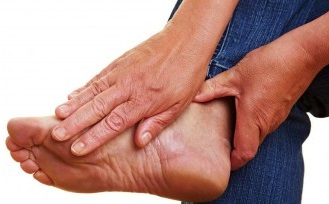 Man Holding His Foot with Gout