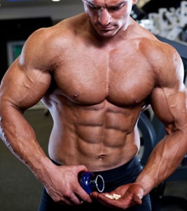 Bodybuilder with Bottle of Supplements